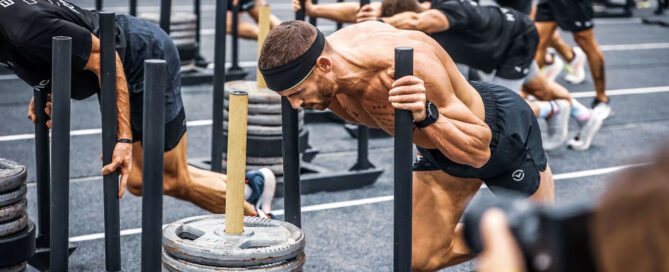 Athletes training together during a HYROX-style workout to improve community and retention