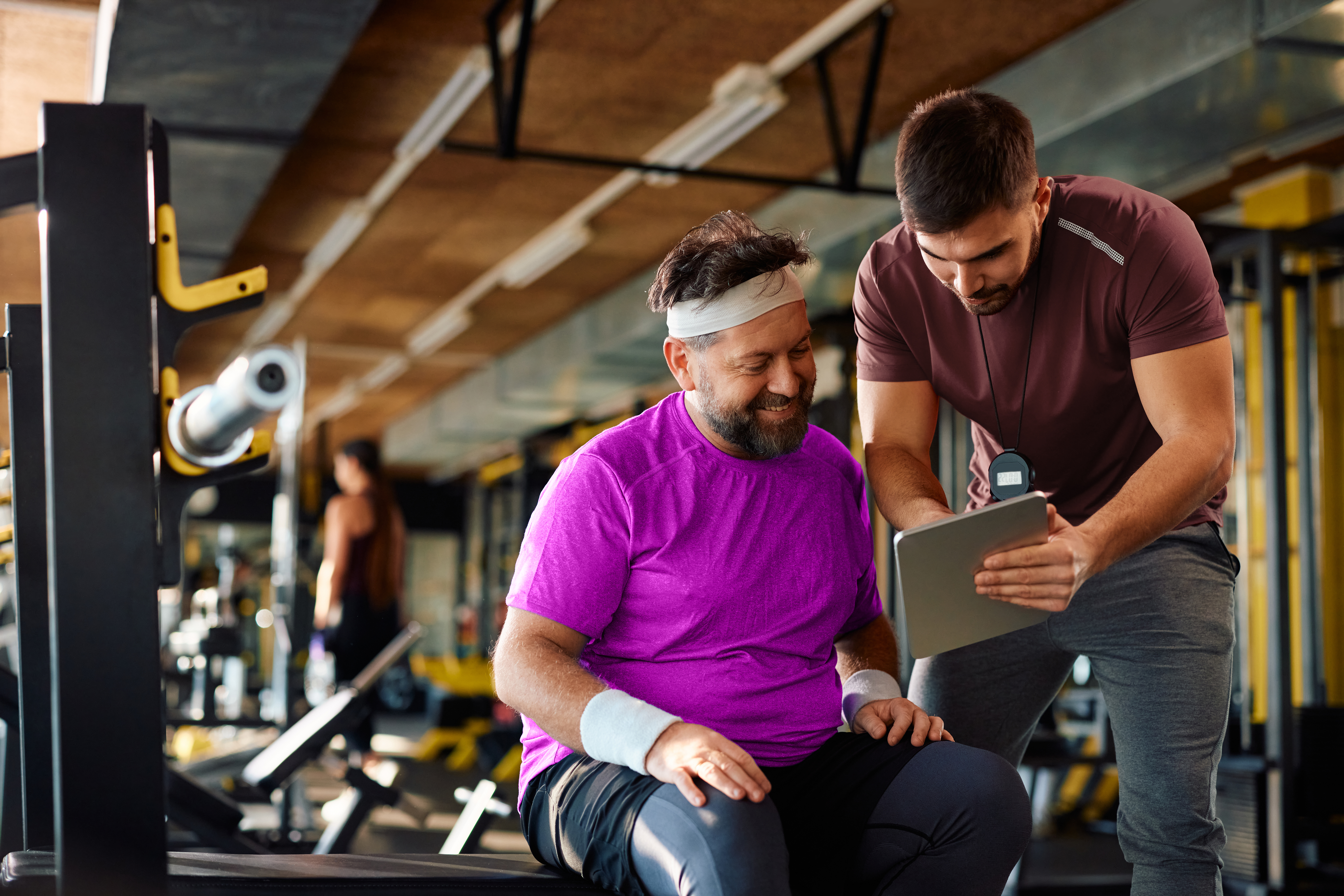 AdobeStock_731070681-core A gym owner supporting and motivating a gym member to build a strong relationship.