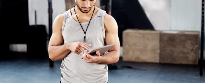 Gym owner reviewing a 2026 campaign calendar and member engagement plan