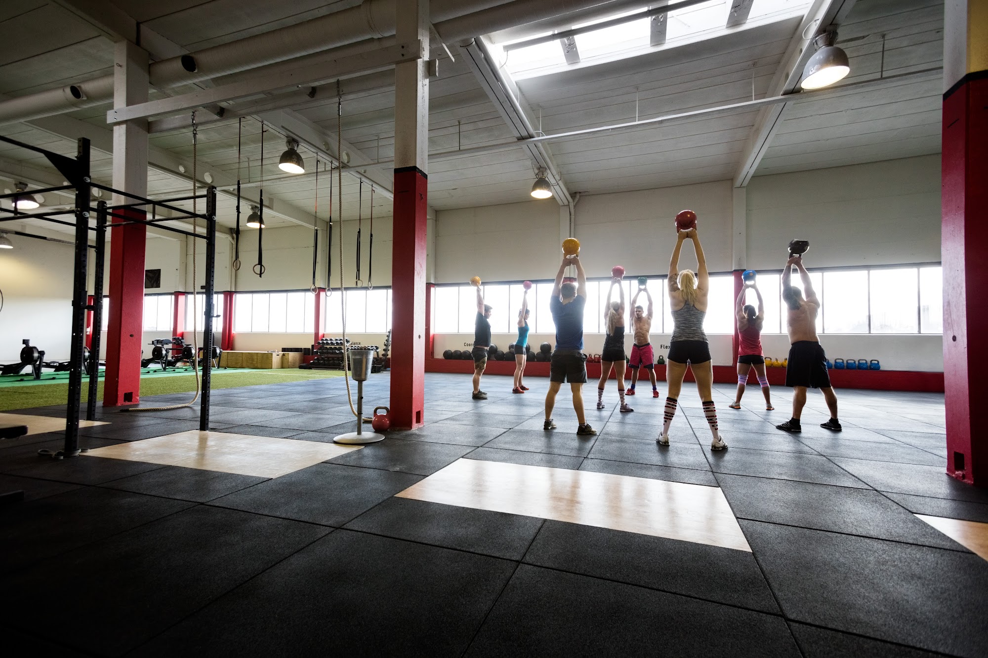 Gym owners reviewing scalable gym management software metrics on tablets