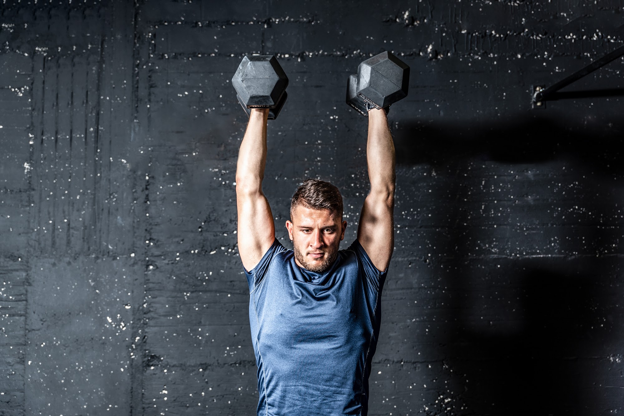 Gym owner reviewing software security protocols at a desk.