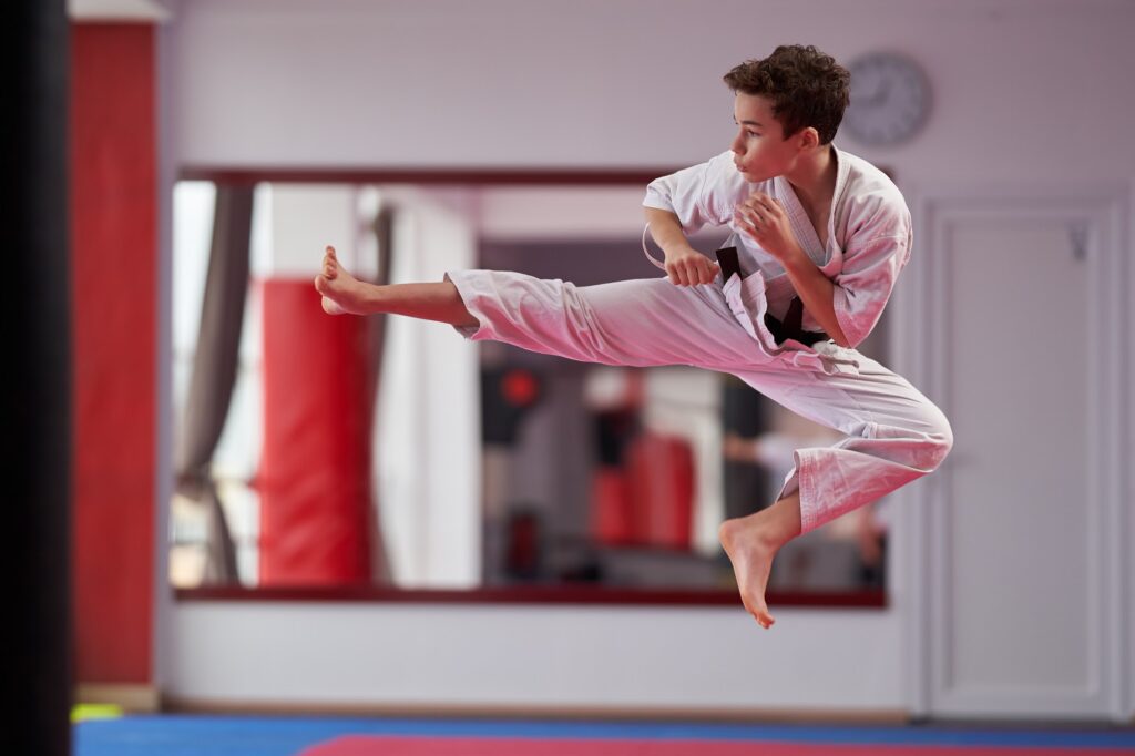 Dojo trainers using class scheduling software on a tablet