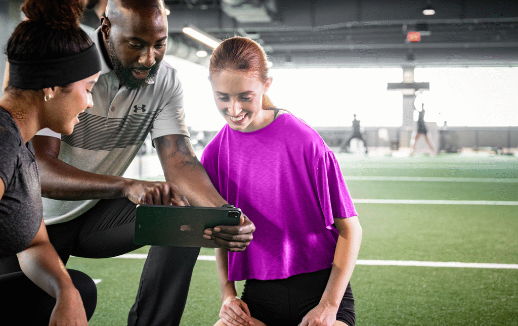 Gym owner using management software to monitor operations and member activity