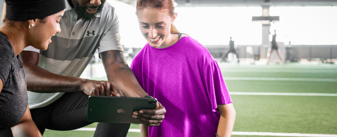 Gym owner using management software to monitor operations and member activity