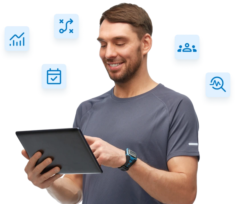 gymowner-04-1 A smiling man in athletic wear uses a tablet, surrounded by icons representing analytics, planning, scheduling, members, and performance tracking.