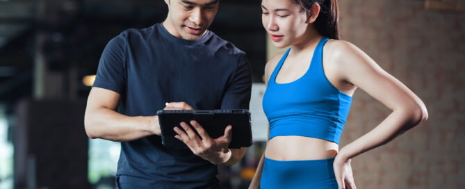 Multi-location gym owner reviewing business performance across multiple facilities