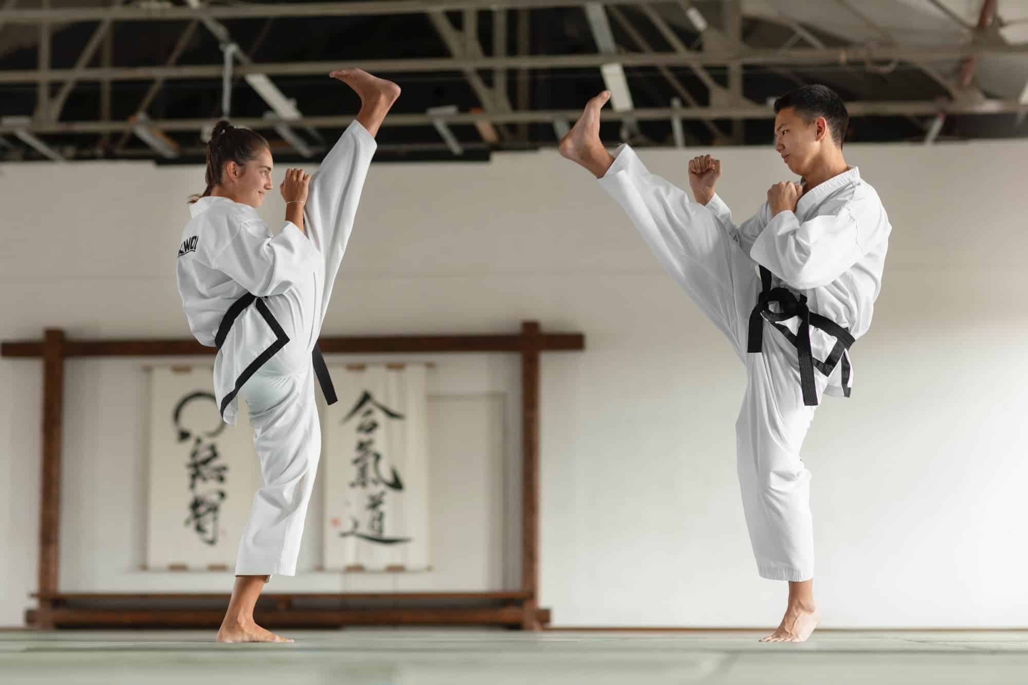 Martial arts instructor reviewing class schedules and student attendance