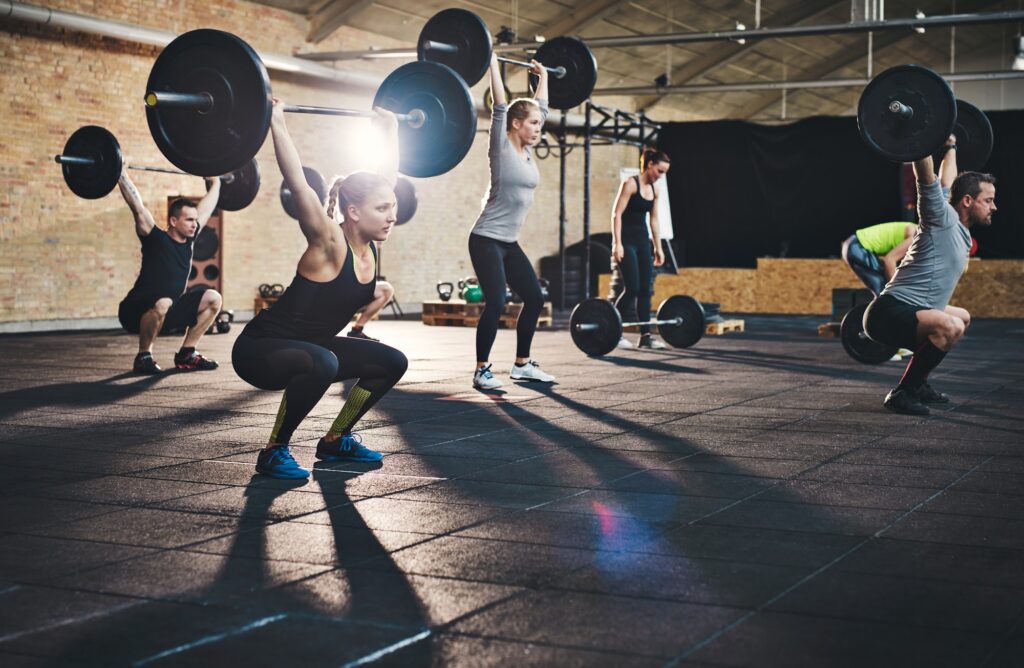 New members greeted by staff in a modern gym