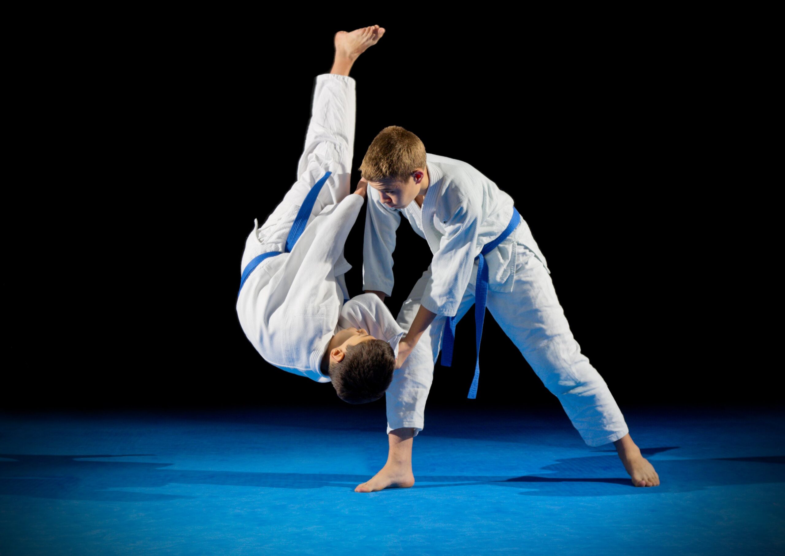 how-to-choose-martial-arts-school-management-software Martial arts instructor using Daxko Zen Planner software to manage class schedules, memberships, and student engagement.